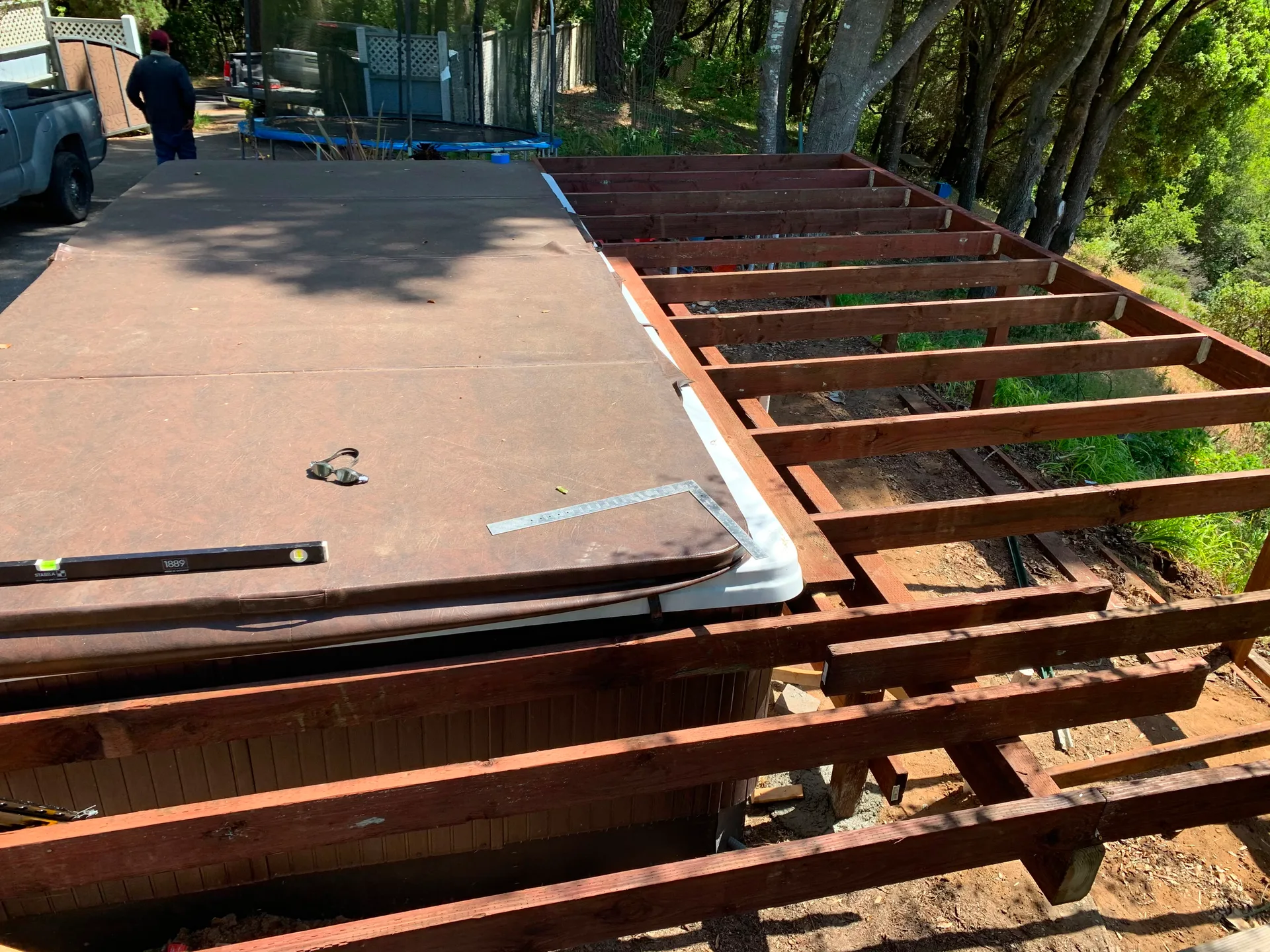 Deck framing built around a hot tub