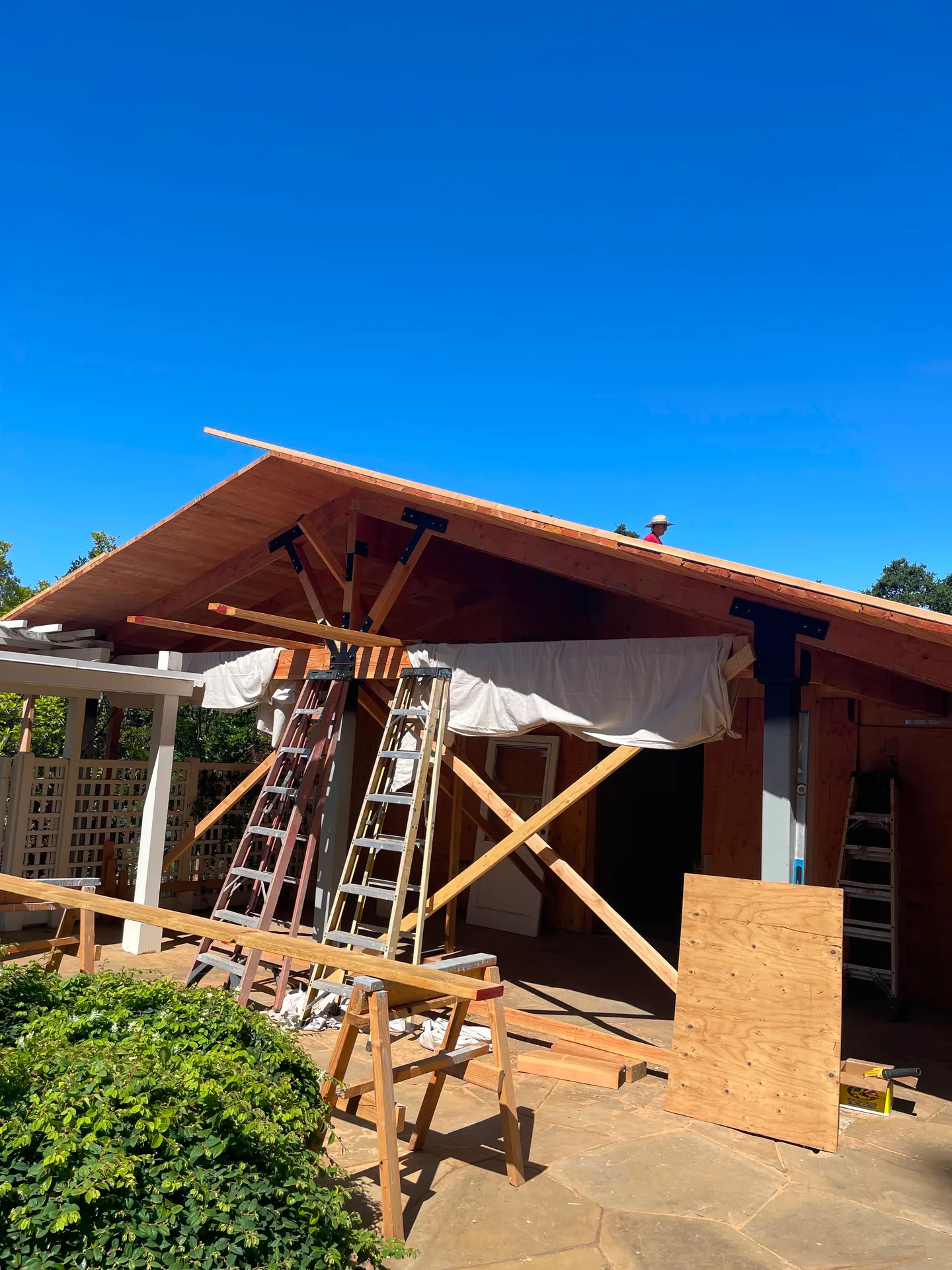 Crew member working on patio cover framing